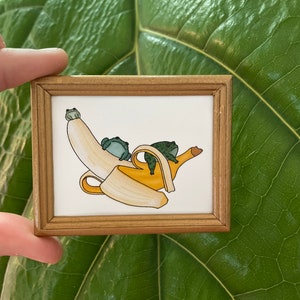 Frogs going bananas mini framed print