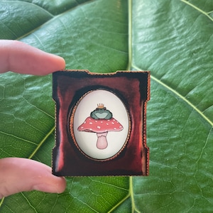 Tiny framed frog prince