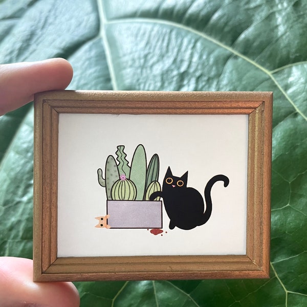 Tiny Cats and cactus in frame