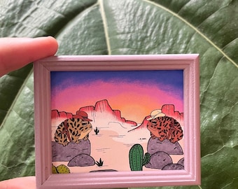 Tiny gunslinger toads in a frame