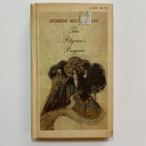 May include: A vintage paperback book cover with a tan background. The title "The Pilgrim's Progress" is printed in black text. The cover features an illustration of three figures walking on a path through a forest. The figures are surrounded by trees and flowers.