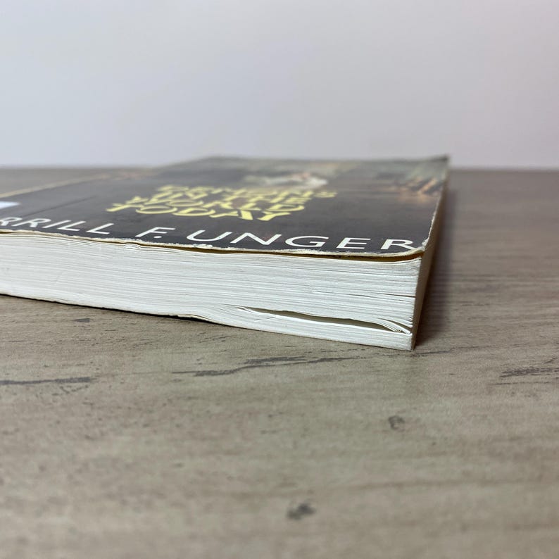 May include: A hardcover book with a black cover and gold lettering. The title "Anything Today" is visible, along with the author's name, "Brill E. Unger". The book's pages are white, and the spine is visible.