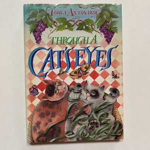 Through a Cat&#39;s Eyes by Toula Antonakos – 1988 Hardcover, Sidgwick & Jackson Limited Edition