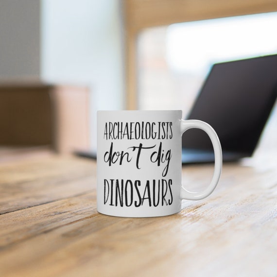 Archaeology Gift Mug - Archaeologists Don't Dig Dinosaurs