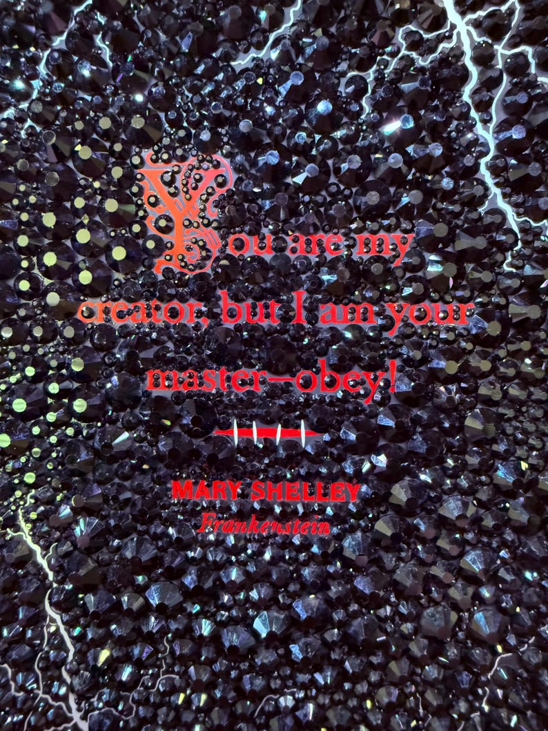 May include: A dark background covered in black, faceted crystals with red text that reads "You may create, but I am your master-obey!" and "MARY SHELLEY Frankenstein". White lightning bolts are in the background.