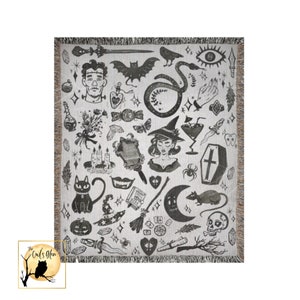 May include: Black and white woven throw blanket with a repeating pattern of various witchy and spooky imagery, including a witch, a cat, a snake, a coffin, a skull, a crescent moon, a spider, a potion bottle, a broom, a heart, a bat, a hand, a dagger, a feather, a crystal, a candle, a mirror, a tooth, a pumpkin, a star, and a crescent moon.