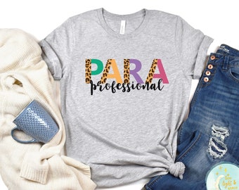 May include: A grey t-shirt with the word "PARA" in colourful letters with leopard print accents and the word "professional" underneath.