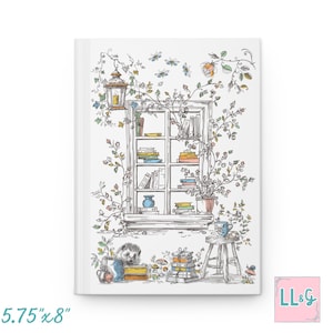 May include: A white hardcover journal featuring a detailed line drawing of a window filled with books, a hanging lantern, and climbing vines. Below the window, a hedgehog sits near a stack of books, a small wooden stool, and a cup. Dimensions: 5.75" x 8".