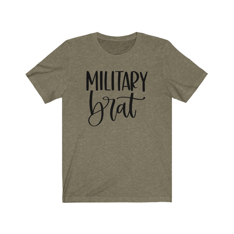May include: A green t-shirt with the text "MILITARY brat" in black lettering.