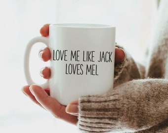 May include: White ceramic mug with black text that reads "Love me like Jack loves Mel".