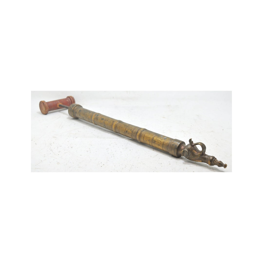 antique holi pichkari in brass
