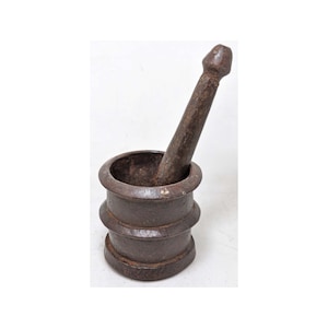 May include: A dark brown wooden mortar and pestle. The mortar is cylindrical with a slightly flared top and a rounded bottom. The pestle is long and slender with a rounded top.