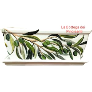 Rechteckiger Terrakotta-Pflanztopf mit handbemalten Oliven. Glänzende Oberfläche, ideal für Balkone und Terrassen.