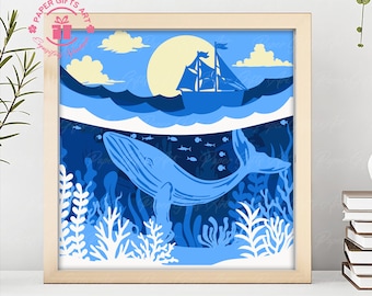 Puede incluir: Una ballena azul nada debajo de un velero en una obra de arte de estilo de corte de papel. La ballena está rodeada de coral y algas marinas. La escena se desarrolla contra un cielo azul con nubes blancas y un sol amarillo.