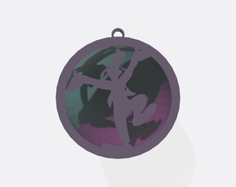 May include: A circular, purple ornament with a silhouetted figure inside. The figure is in a dynamic pose, possibly dancing or performing. The background within the circle has shades of green and purple. A small loop is at the top for hanging.