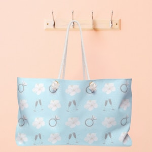 Tropical Wedding Toast Weekender Tote Beach Bag Bridal Tote Flowers Diamond Engagement Rings Champagne Flutes Light Blue Bridal Carry On Bag