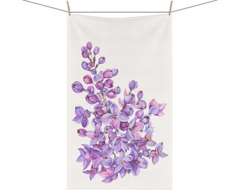 May include: A white kitchen towel with a watercolor illustration of a purple lilac flower bouquet.