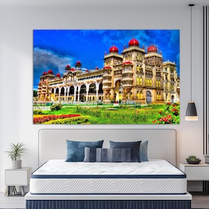 May include: A large, colorful canvas print of a palace with red domes and intricate architecture. The building is set against a vibrant blue sky with clouds, and surrounded by green lawns and colorful flowers.