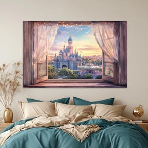 May include: A framed canvas print depicts a fairytale castle scene viewed through an open window with sheer curtains. The castle is gray with blue turrets, set against a sunset sky. The window frame is brown.