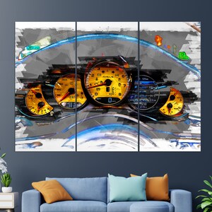 May include: A close-up of a car's dashboard with a speedometer, tachometer, and other gauges. The gauges are yellow and black with a white background. The dashboard is gray and has a blue and white abstract design.