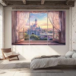 May include: A three-panel canvas art piece depicting a fairytale castle scene viewed through open windows with sheer curtains. The castle is gray with blue turrets, set against a sunset sky. The windows are framed in wood.