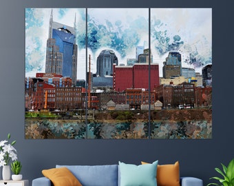 Op de afbeelding: Een aquarel schilderij van de skyline van Nashville, met het iconische AT&T-gebouw, in een blauw en grijs kleurenschema.