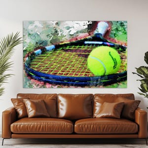 May include: A tennis-themed artwork featuring a tennis racket and ball. The racket has a black frame with a blue accent and yellow strings. A bright yellow tennis ball rests on the strings. The background has green and white paint splatters.