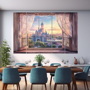 May include: A multi-panel canvas print depicting a fairytale castle scene viewed through a window with sheer curtains. The castle is a focal point, set against a sunset sky. The image is displayed above a dining table with blue chairs.