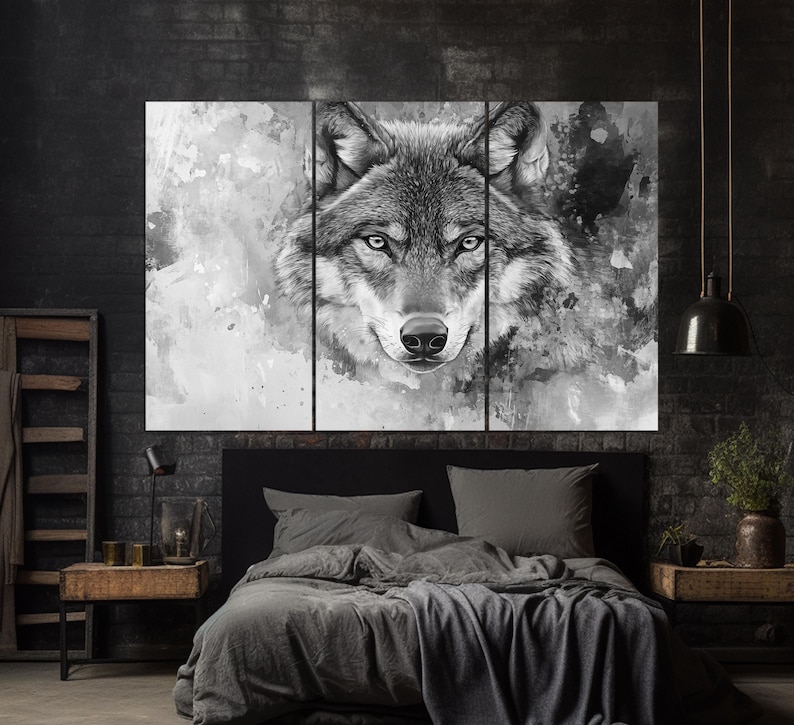 May include: A black and white watercolor painting of a wolf's face. The wolf's eyes are open and staring directly at the viewer. The background is a soft, abstract design.