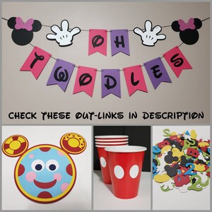 May include: A colourful banner spelling "Twoodles" with Mickey Mouse-themed decorations. The image also shows red cups with white dots, a character face, and confetti, perfect for a themed party.