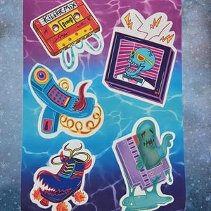 May include: A set of five retro-themed stickers featuring a cassette tape with the text "Killer Mix", a television with a skull wearing sunglasses, a blue rotary phone, a purple video game cartridge with a ghost, and a blue roller skate with red flames.