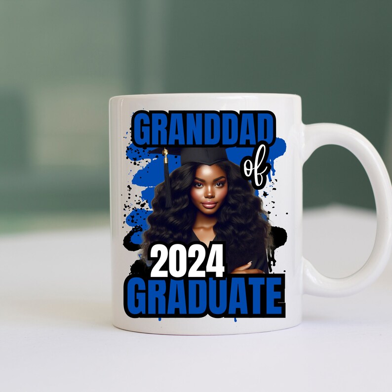 May include: White ceramic mug with a blue and white design. The design features a black woman wearing a graduation cap and gown, with the text "Granddad of 2024 Graduate".