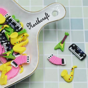 Musical instrument cabochons | Bass  cabochons | Accordion  cabochons |Electronic organ cabochons | Cartoon cabochons |Resin cabochons