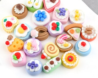 May include: Assortment of 20 colorful miniature clay food items shaped like various desserts, including cakes, cupcakes, cookies, and pastries.