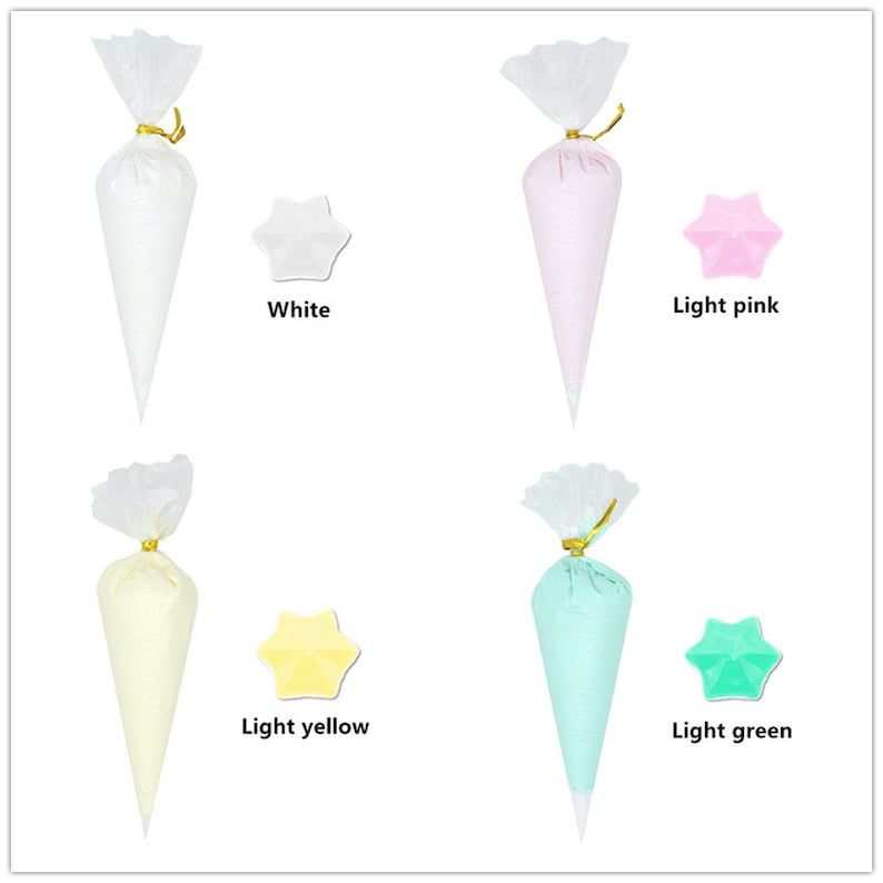 May include: Four clear plastic piping bags filled with different coloured frosting. The bags are tied with gold ribbon. The frosting colours are white, light pink, light yellow, and light green.