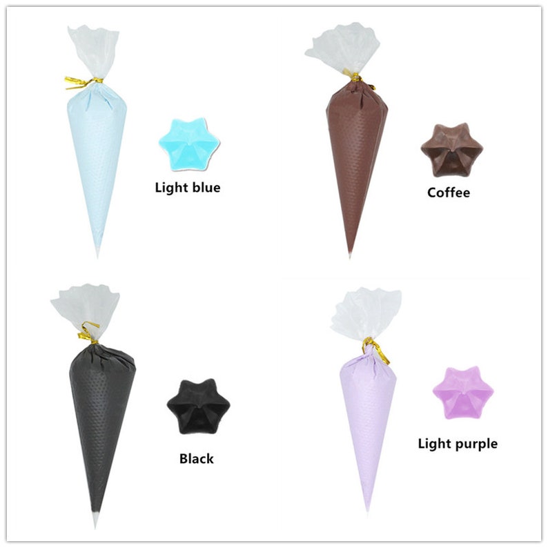 May include: Four disposable piping bags filled with different coloured frosting. The colours are light blue, coffee, black, and light purple. Each bag is tied with a gold ribbon and has a clear plastic cover.