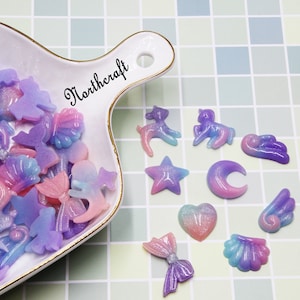 Cabochons ailes | Cabochons Licorne | Cabochons étoiles | Cabochons de coquillages | Cabochons de lune |Cabochons coeur |Cabochons en résine| Cabochons bleus |