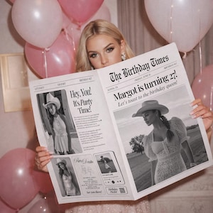 May include: A woman holding a newspaper titled "The Birthday Times" with the headline "Margot is turning 27!". The newspaper features black and white photos and text, with pink balloons in the background.