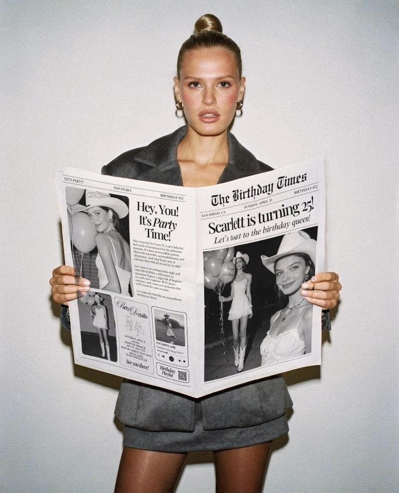 May include: A woman in a gray blazer and skirt holds a newspaper titled "The Birthday Times." The newspaper features the headline "Scarlett is turning 25!" and party-themed images. The woman has her hair up and is wearing hoop earrings.