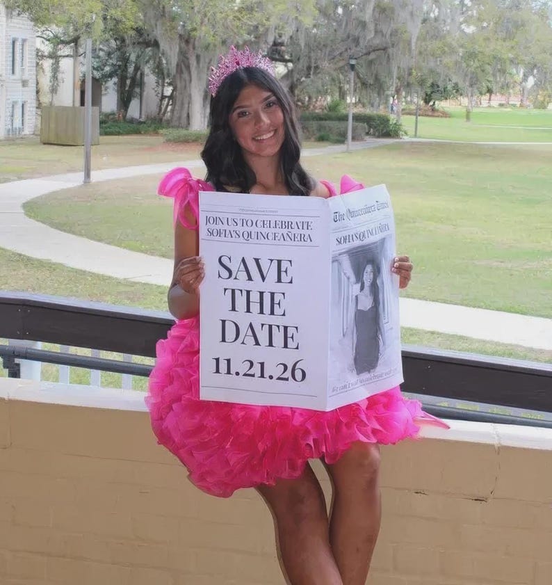 May include: A young person wearing a pink dress and a tiara holds a newspaper-style invitation. The invitation reads "JOIN US TO CELEBRATE SOFIA'S QUINCEA&Ntilde;ERA" and "SAVE THE DATE 11.21.26". The image is taken outdoors.