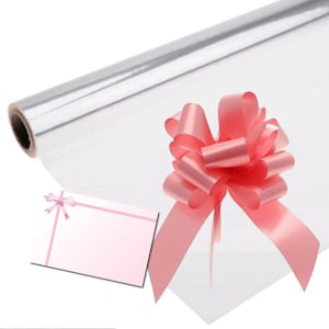 May include: A roll of clear cellophane gift wrap with a pink satin bow. The cellophane is transparent and the bow is tied with a double loop.