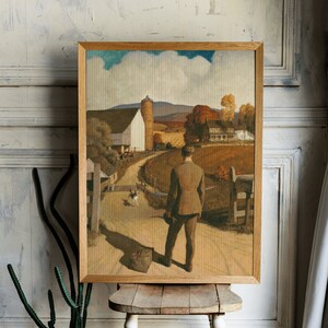 Puede incluir: Una pintura enmarcada que representa a un hombre caminando lejos de una granja en un entorno rural. El hombre lleva un traje marr&oacute;n y lleva una maleta. La granja es blanca con un techo rojo y un silo. El cielo es azul con nubes blancas. La pintura est&aacute; en un marco de madera.