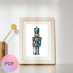 May include: A watercolor painting of a blue toy soldier with a red and white uniform and a gold hat. The soldier is holding a gold staff in his right hand.