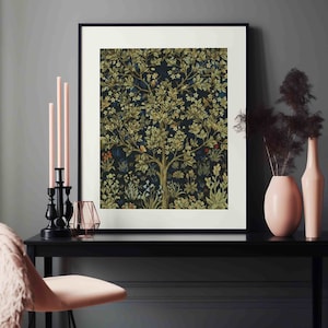 May include: A framed print of a vintage tapestry featuring a stylized tree with green leaves and flowers on a dark blue background.
