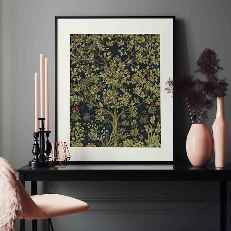 May include: A framed print of a vintage tapestry featuring a stylized tree with green leaves and flowers on a dark blue background.