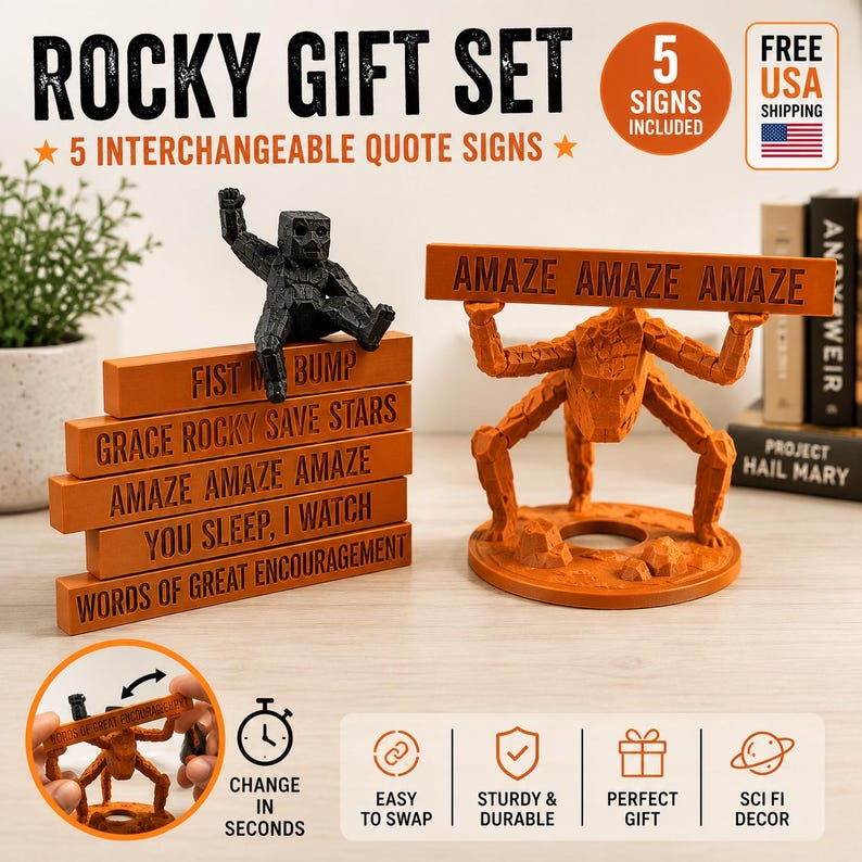 May include: A Rocky gift set featuring five interchangeable orange rectangular signs with black text including FIST ME BUMP, GRACE ROCKY SAVE STARS, AMAZE AMAZE AMAZE, YOU SLEEP I WATCH, and WORDS OF GREAT ENCOURAGEMENT, plus two orange and black figures.