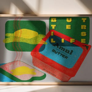 Puede incluir: Una impresión artística enmarcada con una ilustración retro de mantequilla y tostadas, con las palabras "BUTTER LIFE". La obra de arte utiliza una paleta de colores vibrantes de rojo, azul, verde y amarillo. Una adición divertida y peculiar.