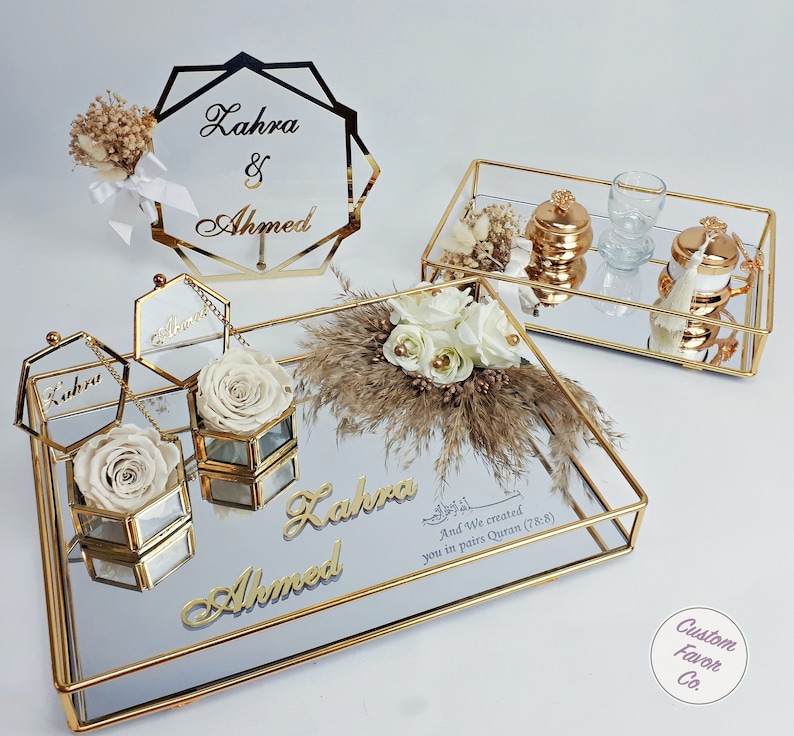 Cream concept islamic nikkah tray set and pink and cream flower nikkah sign for muslim wedding and engagement ceremonies. Including a big and a small nikkah golden ring tray, 2 ring boxes, 2 cream roses, a cream side flower, coffee cup set and sign