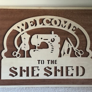 Framed &quot;Welcome To The She Shed&quot; Sign.  Solid 5 Ply Baltic Birch with a Mahogany PureBond Plywood Background.  Handmade on My Scroll Saw