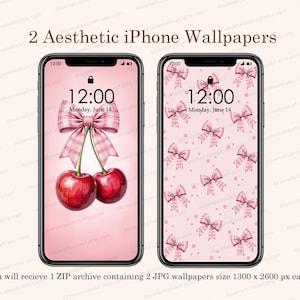 以下が含まれることがあります： ピンクのiPhoneの壁紙が2つ。1つの壁紙は、ピンクの背景にピンクのリボンとチェリーが描かれています。もう1つの壁紙は、ピンクの背景にピンクのリボンが繰り返し描かれたパターンです。どちらの壁紙も、時刻は12:00、日付は6月14日（月）となっています。